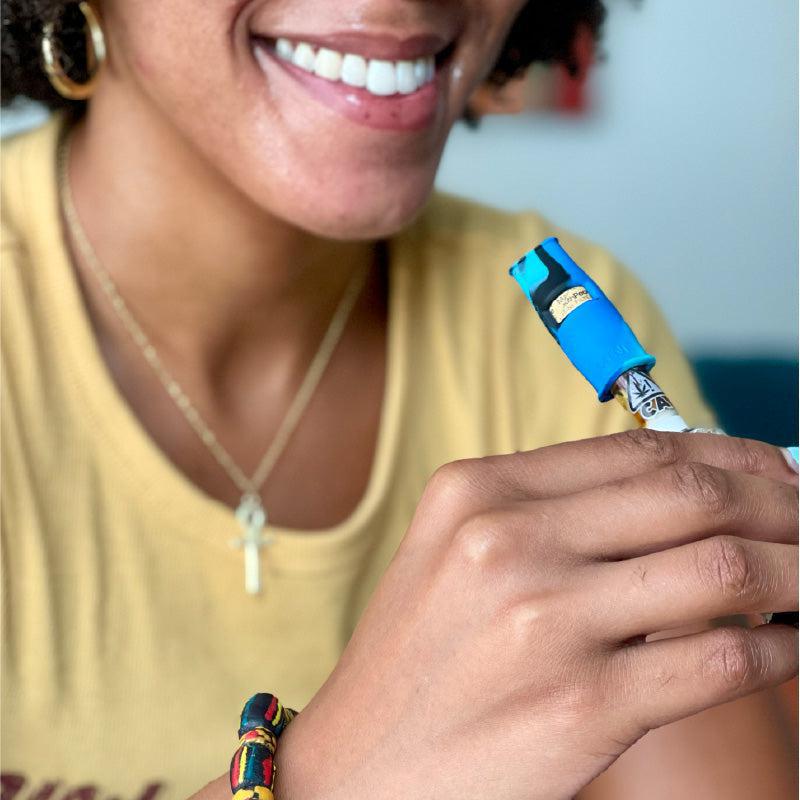 MINI-BLACK676821102973woman smiling using mouthpeace miniBlackMouthPeace MiniMouthPeaceMoose Labs MiniMouthPeace Mini - Moose Labs LLC