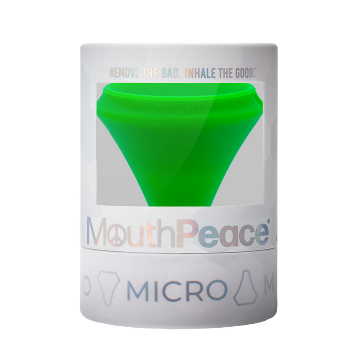 MouthPeace Micro device packaging with green silicone piece on a white background
