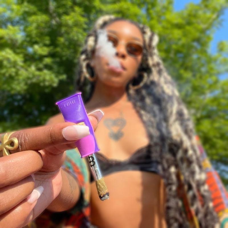 woman holding mouthpeace mini close up